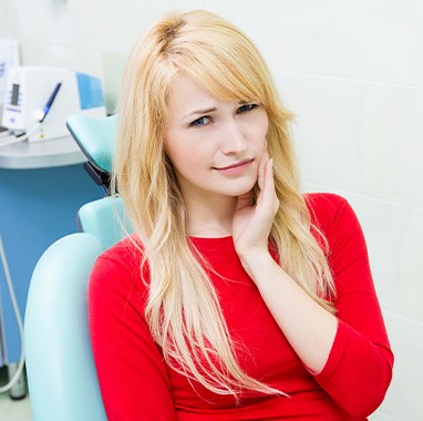 a worried woman with a toothache