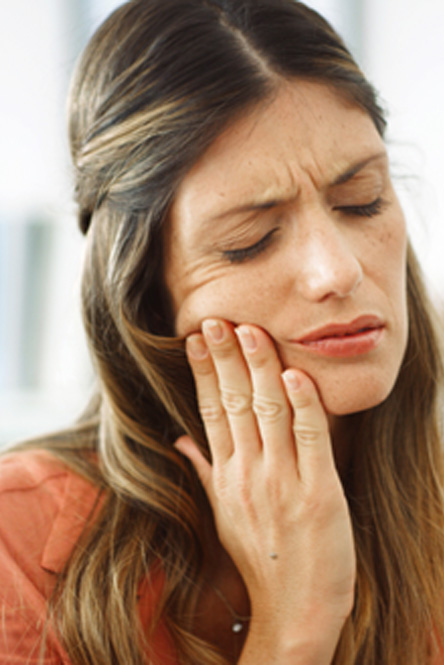 Closeup of woman experiencing toothache