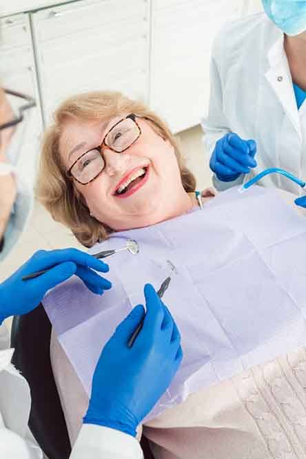 Woman smiling in the dental chair